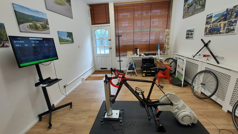 Bike fit lab with turbo trainer and bike fitting tools.